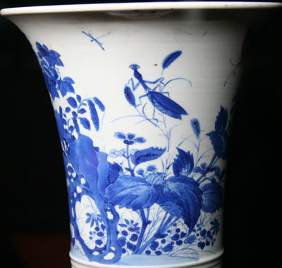 Blue and white porcelain flower container with a praying mantis design Blue and white porcelain flower container with a praying mantis design